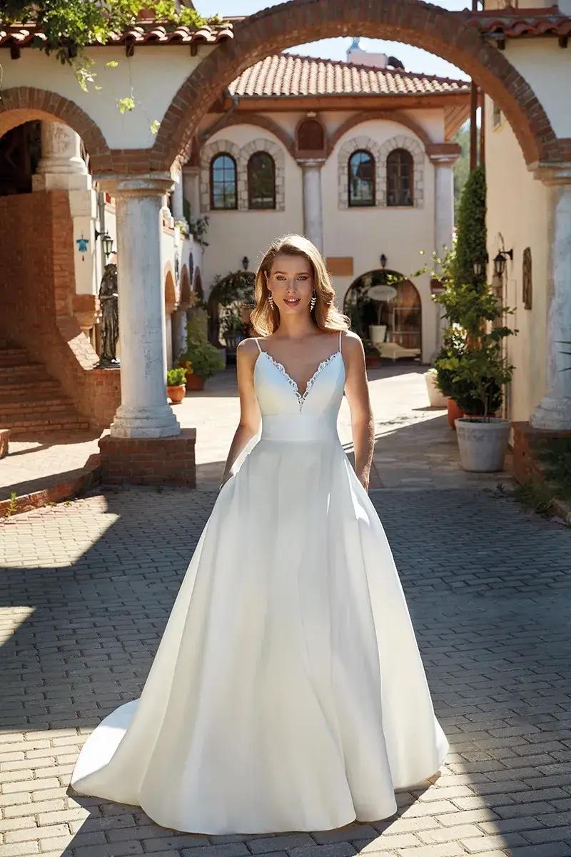 Enchanting Elegance: Unveiling the Timeless Beauty of Eddy K Wedding Gowns. Desktop Image
